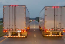 Trucks on highway at night